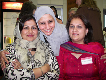 WTB Council member Magda Bayoumi (center) hugs Ramla Shaikh and Kulsoom Shaikh.