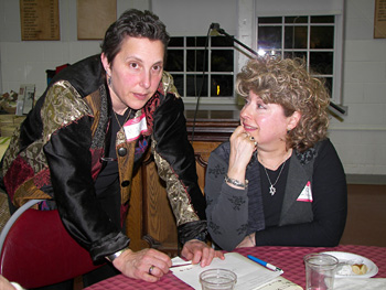 Mara Sapon-Shevin, a WTB Council member, plans the closing song with Francine Berg.